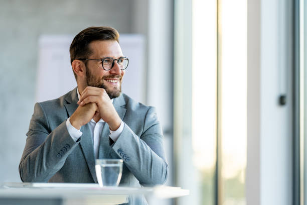 business man looking outside the window in an office